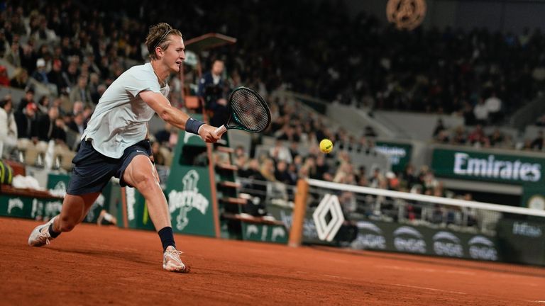 Sebastian Korda of the United States plays a shot against Carlos Alcaraz of Spain during their third-round match of the French Open tennis tournament at the Roland Garros stadium in Paris, Friday, May 31, 2024. (AP Photo/Thibault Camus)