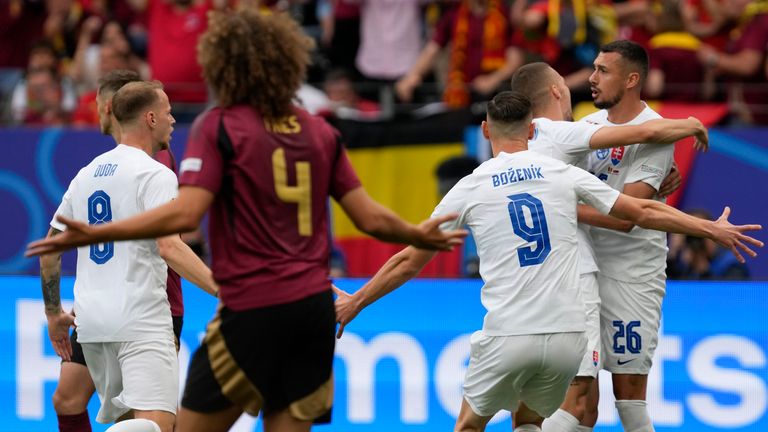 Slovakia's Ivan Šranc celebrates with his teammates after scoring against Belgium in Group E of Euro 2024