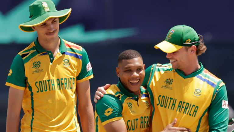 South Africa players celebrate after their win in the ICC Men's T20 World Cup cricket match between Bangladesh and South Africa at the Nassau County International Cricket Stadium in Westbury, New York, Monday, June 10, 2024. (AP Photo/Adam Hunger)