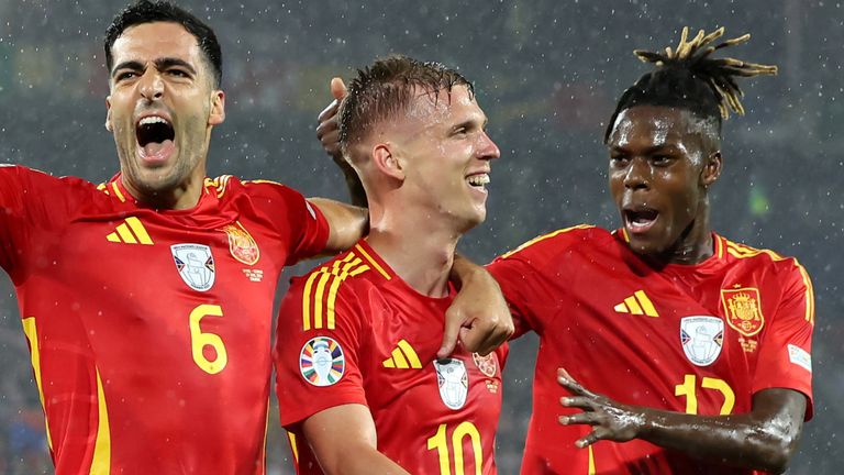 COLOGNE, GERMANY - JUNE 30: Dani Olmo of Spain celebrates scoring his team's fourth goal with teammates Mikel Merino and Nico Williams during the UEFA EURO 2024 round of 16 match between Spain and Georgia at Cologne Stadium on June 30, 2024 in Cologne, Germany. (Photo by Alex Grimm/Getty Images)