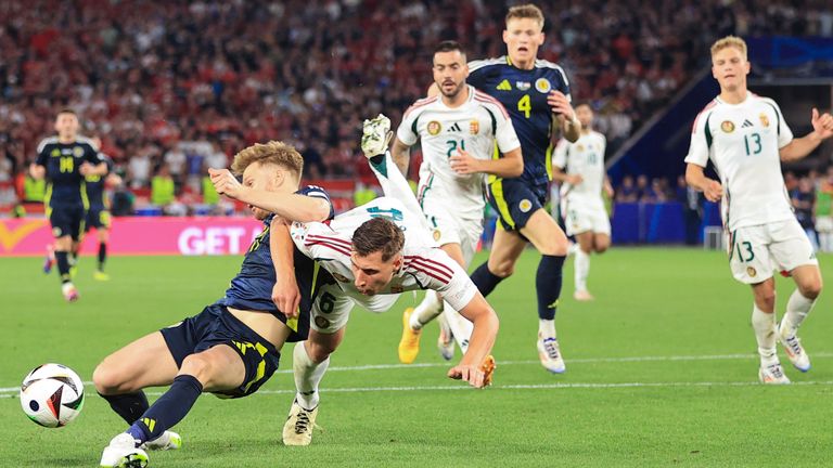 STUTTGART, GERMANY - JUNE 23: Willi Orban of Hungary tangles with Stuart Armstrong of Scotland and no penalty is awarded during the UEFA EURO 2024 group stage match between Scotland and Hungary at Stuttgart Arena on June 23, 2024 in Stuttgart, Germany.(Photo by Simon Stacpoole/Offside/Offside via Getty Images)