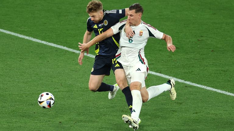 STUTTGART, GERMANY - JUNE 23: Stuart Armstrong of Scotland is challenged by Willi Orban of Hungary in the penalty area during the UEFA EURO 2024 group stage match between Scotland and Hungary at Stuttgart Arena on June 23, 2024 in Stuttgart, Germany. (Photo by Florencia Tan Jun - UEFA/UEFA via Getty Images)