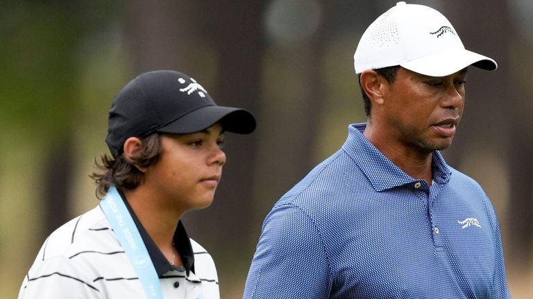 Tiger Woods walks with his son Charlie on the 11th hole during a practice round for the U.S. Open golf tournament Monday, June 10, 2024, in Pinehurst, N.C. (AP Photo/Matt York)