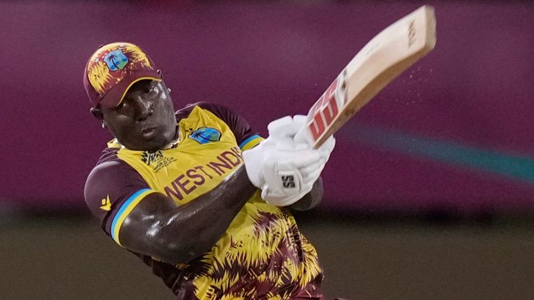 West Indies' captain Rovman Powell plays a shot to be caught by Uganda's Robinson Obuya for 23 runs during an ICC Men's T20 World Cup cricket match at Guyana National Stadium in Providence, Guyana, Saturday, June 8, 2024. (AP Photo/Ramon Espinosa)