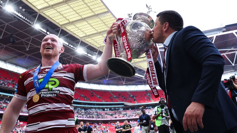 Picture by Ed Sykes/SWpix.com - 08/06/2024 - Rugby League - Betfred Challenge Cup Final - Warrington Wolves v Wigan Warriors - Wembley Stadium, London, England -Liam Farrell and head coach Matt Peet raise the Trophy
