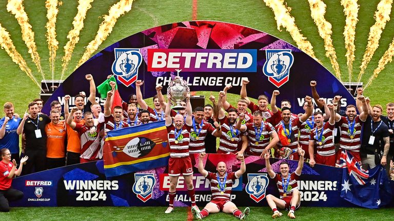 Picture by Allan McKenzie/SWpix.com - 08/06/2024 - Rugby League - Betfred Challenge Cup Final - Warrington Wolves v Wigan Warriors - Wembley Stadium, London, England - Wigan Warriors raises the Betfred Challenge Cup after victory over Warrington Warriors