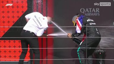 Hamilton and Bono have champagne fight on podium!