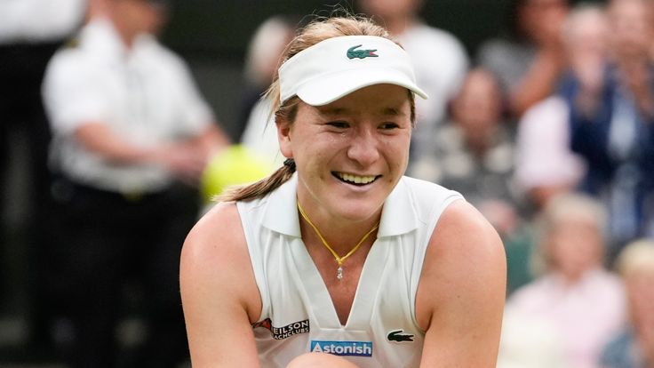 Lulu Sun of New Zealand celebrates after defeating Emma Raducanu of Britain in their fourth round match at the Wimbledon tennis championships in London, Sunday, July 7, 2024. (AP Photo/Alberto Pezzali)