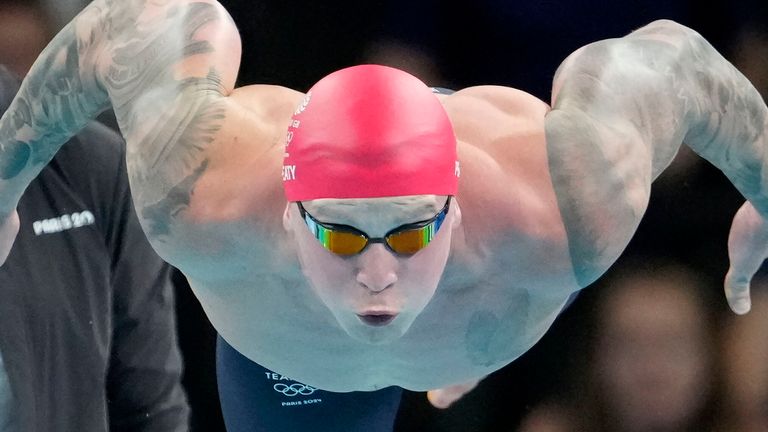 Adam Peaty, of Britain, competes in the men's 100-meter breaststroke final at the 2024 Summer Olympics, Sunday, July 28, 2024, in Nanterre, France. (AP Photo/Matthias Schrader)