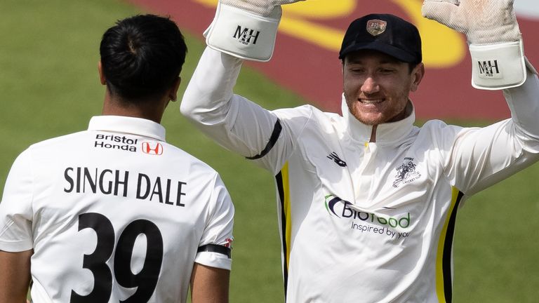 NORTHAMPTON, ENGLAND - MAY 13: Ajeet Singh Dale of Gloucestershire (left) celebrates with his team mate, wicketkeeper James Bracey, after taking the wicket of Liam Patterson-White (not shown) during the Vitality County Championship division two match between Northamptonshire and Gloucestershire at The County Ground on May 13, 2024 in Northampton, England. (Photo by Andy Kearns/Getty Images)