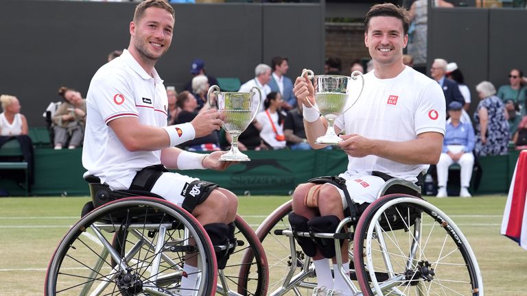 Great Britain's Alfie Hewett (left) and Gordon Reid celebrate with the trophies after victory…