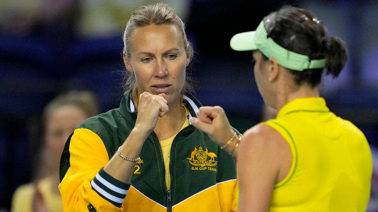 Australia team captain Alicia Molik bumps fists with Australia's Ajla Tomljanovic, right, during her final match of the Billie Jean King Cup tennis finals against Switzerland's Belinda Bencic, at the Emirates Arena in Glasgow, Scotland, Sunday, Nov. 13, 2022. (AP Photo/Kin Cheung)