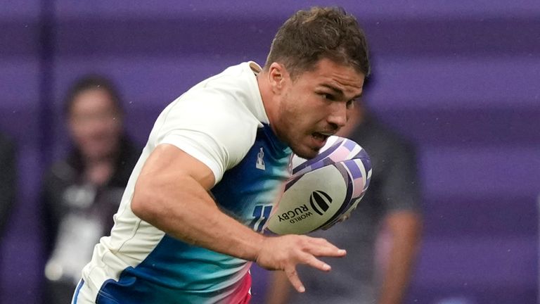 Antoine Dupont of France races clear of Fiji's Waisea Nacuqu to score a try during the men's gold medal Rugby Sevens match between France and Fiji at the 2024 Summer Olympics, in the Stade de France, in Saint-Denis, France, Saturday, July 27, 2024. (AP Photo/Vadim Ghirda)