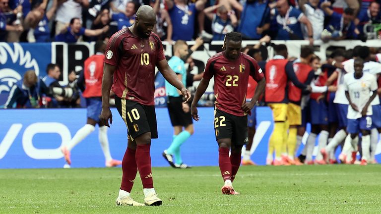 Belgium's Romelu Lukaku and Belgium's Jeremy Doku react after 1-0 a soccer match between France and Belgium national soccer team Red Devils, Monday, July 01, 2024 in Dusseldorf, Germany, the UEFA Euro 2024 European Championship round of 16 match. BELGA PHOTO BRUNO FAHY (Photo BRUNO FAHY / BELGA MAG / Belga via AFP)