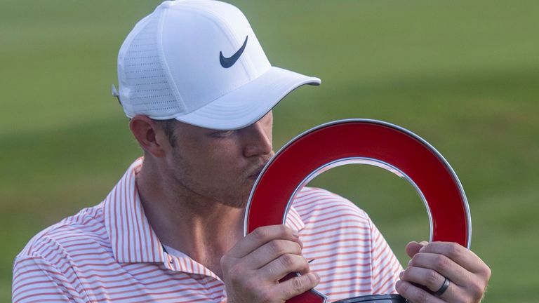 DETROIT, MI - JUNE 30: Cam Davis (Australia) kisses the trophy after winning the fourth round of the Rocket Mortgage Classic on June 30, 2024 at Detroit Golf Club in Detroit, Michigan.  (Photo by Joseph Weiser/Icon Sportswire) (Icon Sportswire via AP Images)