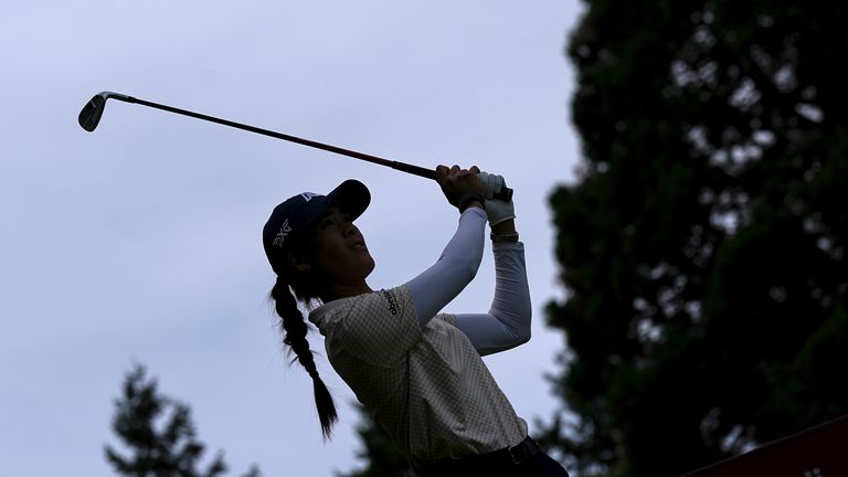 Celine Boutier, of France, follows her ball after playing on the second hole during the third round of the Evian Championship women's golf tournament, in Evian, eastern France, Saturday, July 13, 2024. (AP Photo/Laurent Cipriani)