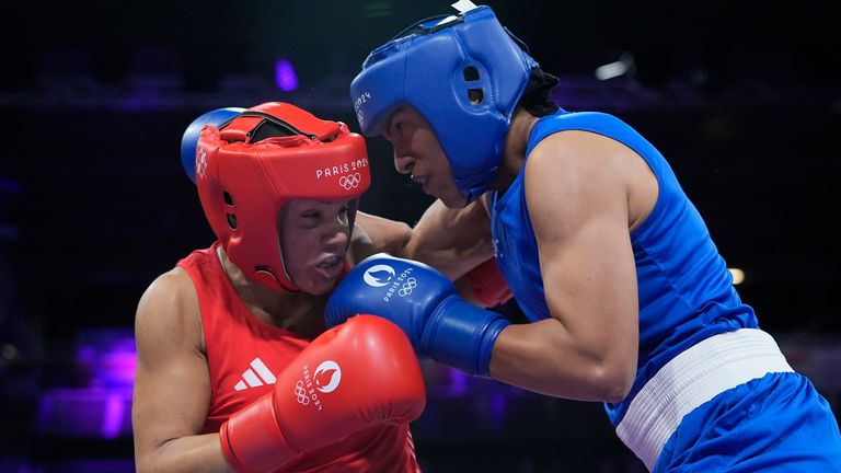 Britain's Chantelle Reid, left, fights Morocco's Khadija Mardi in their women's 75 kg preliminary boxing match at the 2024 Summer Olympics, Wednesday, July 31, 2024, in Paris, France. (AP Photo/Ariana Cubillos)