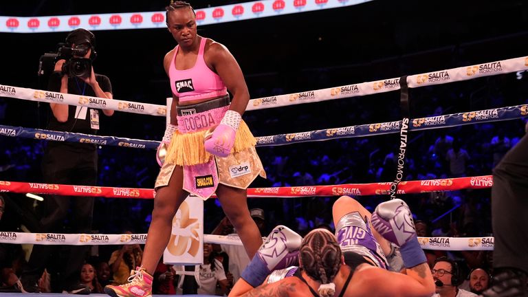 Middleweight champion Claressa Shields looks down reigning WBC women's heavyweight boxing champion Vanessa Lepage-Joanisse of Quebec during a fight, Saturday, July 27, 2024, in Detroit. (AP Photo/Carlos Osorio)