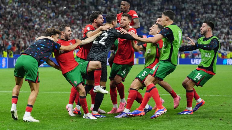 Costa is mobbed by his Portugal team-mates
