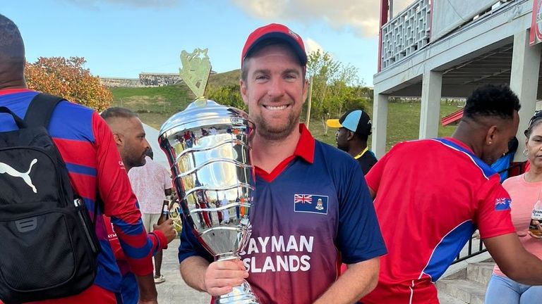 Sam Foster with the trophy after the Cayman Islands beat the Bahamas 3-2