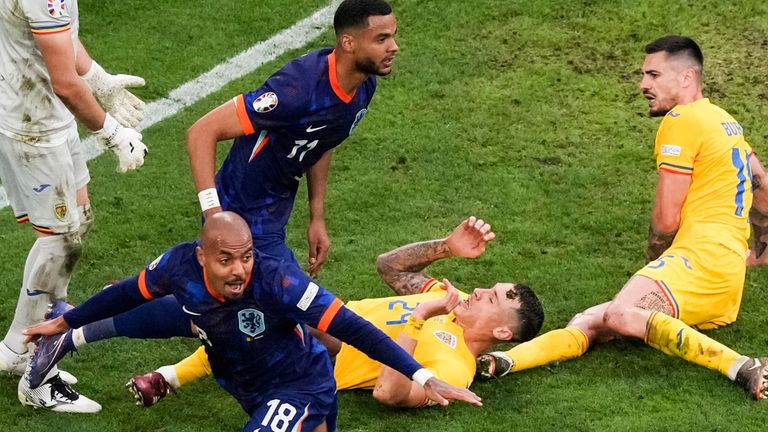Donyell Malen of the Netherlands, bottom center, reacts after scoring his side's second goal during a round of sixteen match between Romania and the Netherlands at the Euro 2024 soccer tournament in Munich, Germany, Tuesday, July 2, 2024. (AP Photo/Frank Augstein)