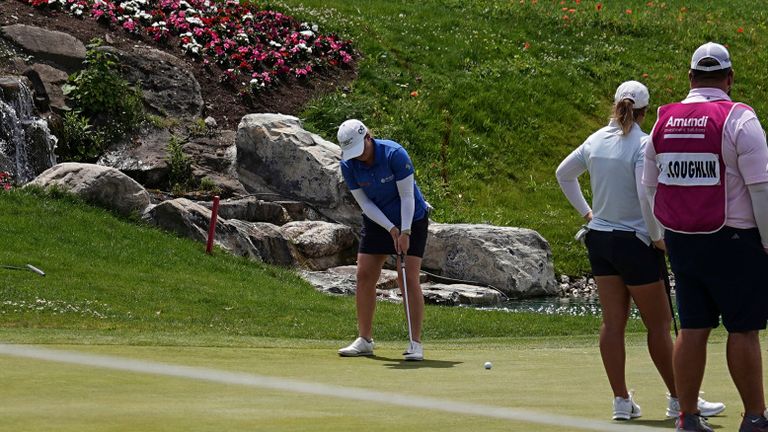 Spectators watch Gemma Dryburgh, of Scotland, play on the fifth hole during the third round of the Evian Championship women's golf tournament, in Evian, eastern France, Saturday, July 13, 2024. (AP Photo/Laurent Cipriani)