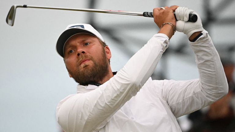 England's Daniel Brown watches his iron shot from the 17th tee on the opening day of the 152nd Open Championship at Royal Troon