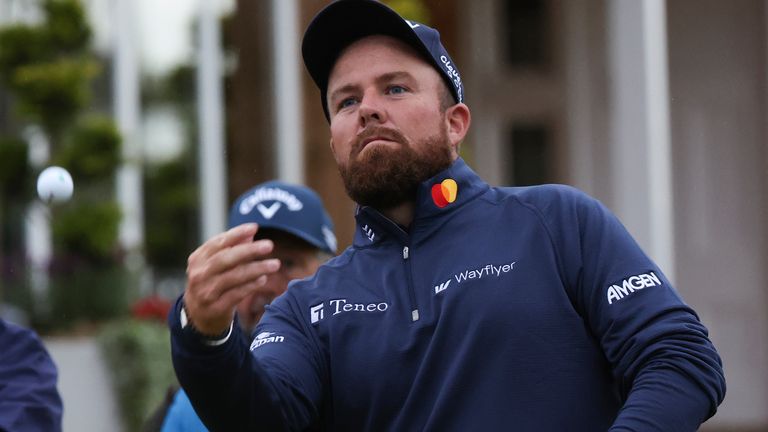 Shane Lowry of Ireland throws his ball into the crowd as he walks from the 18th green following his opening round of The Open Golf Championships at Royal Troon