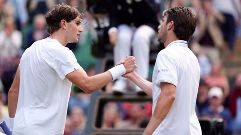 Jack Draper (left) and Cameron Norrie shake hands after their match on day four of the 2024 Wimbledon Championships at the All England Lawn Tennis and Croquet Club, London. Picture date: Thursday July 4, 2024.