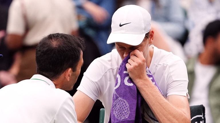 Jannik Sinner has a medical time out during his match against Daniil Medvedev on day nine of the 2024 Wimbledon Championships at the All England Lawn Tennis and Croquet Club, London. Picture date: Tuesday July 9, 2024.