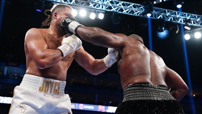 Derek Chisora lands a blow on heavyweight rival Joe Joyce on his way to a stunning victory