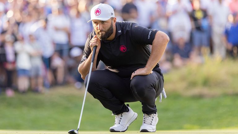 Captain Jon Rahm of Legion XIII lines up a putt on the 18th green during the final round of LIV Golf United Kingdom by JCB at JCB Golf & Country Club on Sunday, July 28, 2024 in Rocester, England. (Photo by Chris Trotman/LIV Golf via AP)