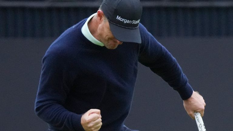 Justin Rose of England reacts after sinking a putt on the 18th green during his third round of the British Open Golf Championships at Royal Troon golf club in Troon, Scotland, Saturday, July 20, 2024. (AP Photo/Jon Super)