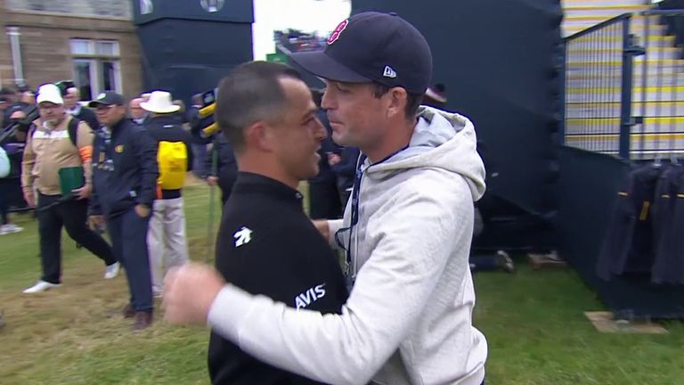 Schauffele (left) is embraced by 2025 USA Ryder Cup captain Keegan Bradley following his Open success