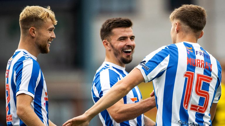 KILMARNOCK, SCOTLAND - JULY 19: Fraser Murray celebrates with Danny Armstrong and David Watson after scoring to make it 5-0 during a pre-season friendly match between Kilmarnock and Barrow AFC at Rugby Park, on July 19, 2024, in Kilmarnock, Scotland. (Photo by Alan Harvey / SNS Group)