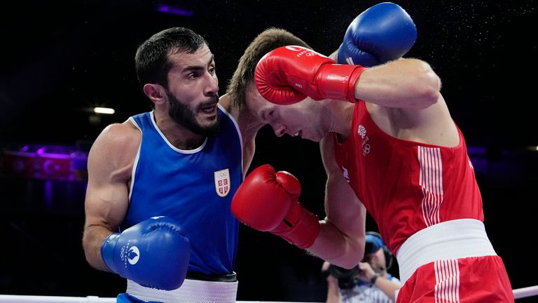 Britain's Lewis Richardson, right, fights Serbia's Vakhid Abbasov in their men's 71 kg preliminary boxing match at the 2024 Summer Olympics, Wednesday, July 31, 2024, in Paris, France. (AP Photo/Ariana Cubillos)