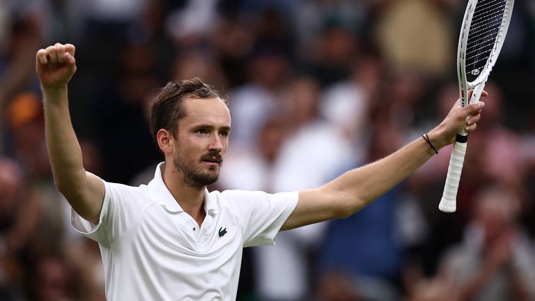 Russia's Daniil Medvedev celebrates after defeating Italy's Jannik Sinner in the men's singles quarter-finals on day 9 of the 2024 Wimbledon Championships at the All England Lawn Tennis and Croquet Club in Wimbledon, southwest London, on July 9, 2024. Medvedev won the match 6-7, 6-4, 7-6, 2-6, 6-3. (Photo by Henry Nicholls/AFP) / Editorial use restricted