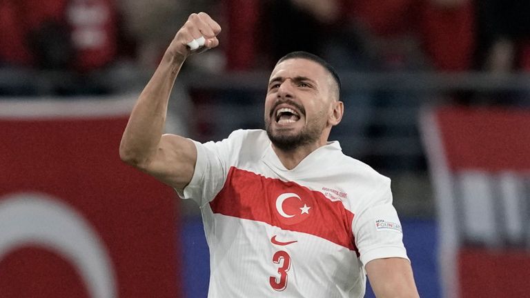 Turkey's Merich Demiral (center) celebrates his team's opening goal against Austria during the Euro 2024 round of 16 soccer match in Leipzig, Germany, Tuesday, July 2, 2024. (AP Photo/Thanassis Stavrakis)