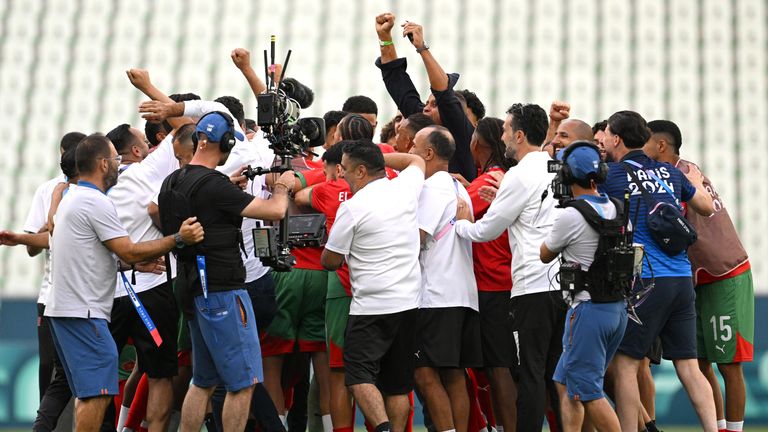 SAINT-ETIENNE, FRANCE - JULY 24: Players from Team Morocco celebrates following the team's victory in the Men's group B match between Argentina and Morocco during the Olympic Games Paris 2024 at Stade Geoffroy-Guichard on July 24, 2024 in Saint-Etienne, France. (Photo by Tullio M. Puglia/Getty Images)