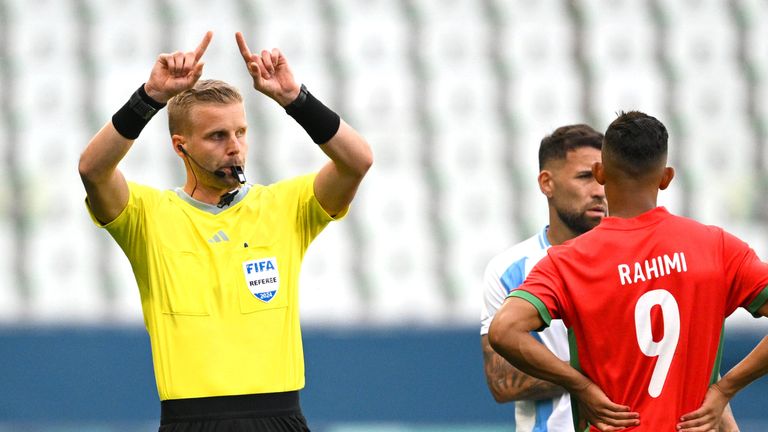 SAINT-ETIENNE, FRANCE - JULY 24: Referee Glenn Nyberg gestures after VAR disallowed Team Argentina's second goal during the Men's group B match between Argentina and Morocco during the Olympic Games Paris 2024 at Stade Geoffroy-Guichard on July 24, 2024 in Saint-Etienne, France. (Photo by Tullio M. Puglia/Getty Images)