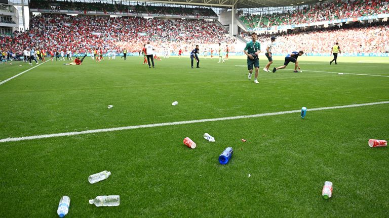 SAINT-ETIENNE, FRANCE - JULY 24: A general view inside the stadium as staff remove bottles from the pitch which had been thrown from the stands during the Men's group B match between Argentina and Morocco during the Olympic Games Paris 2024 at Stade Geoffroy-Guichard on July 24, 2024 in Saint-Etienne, France. (Photo by Tullio M. Puglia/Getty Images)