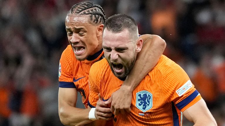 Stefan de Vrij of the Netherlands, right, celebrates with Xavi Simons of the Netherlands after scoring his sides first goal during a quarterfinal match between the Netherlands and Turkey at the Euro 2024 soccer tournament in Berlin, Germany, Saturday, July 6, 2024. (AP Photo/Antonio Calanni)