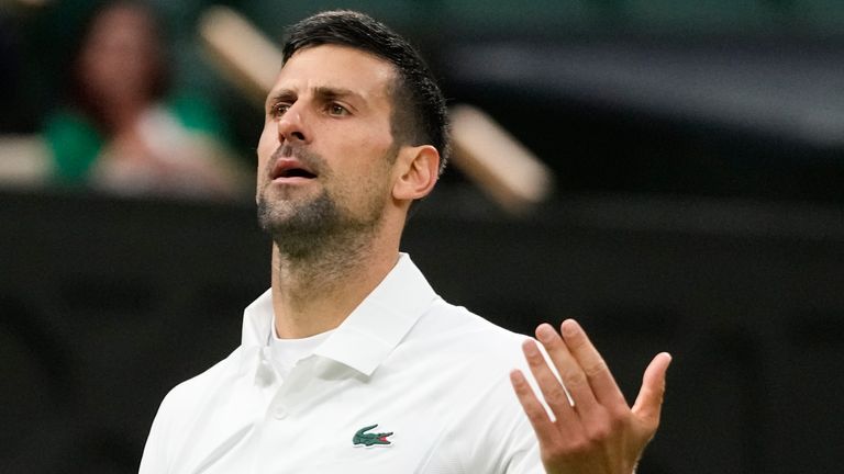 Novak Djokovic of Serbia reacts during his fourth round match against Hulger Rune of Denmark at the Wimbledon tennis championships in London, Monday, July 8, 2024. (AP Photo/Kirsty Wigglesworth)