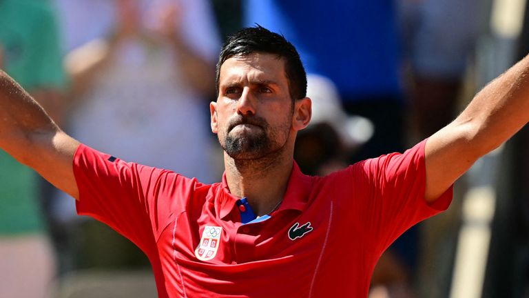 Serbia's Novak Djokovic reacts to his win over Spain's Rafael Nadal in their men's singles second round tennis match on Court Philippe-Chatrier at the Roland-Garros Stadium at the Paris 2024 Olympic Games, in Paris on July 29, 2024. (Photo by Martin  BERNETTI / AFP)