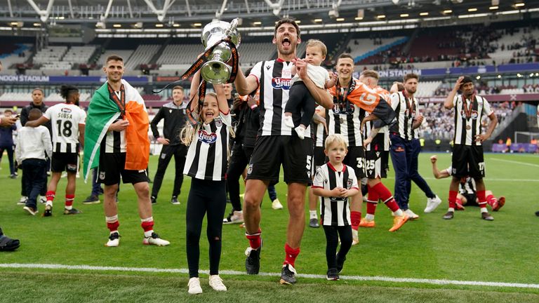 Grimsby Town�s Shaun Pearson celebrates with his family after the Vanarama National League play off final match at the London Stadium, London. Picture date: Sunday June 5, 2022.