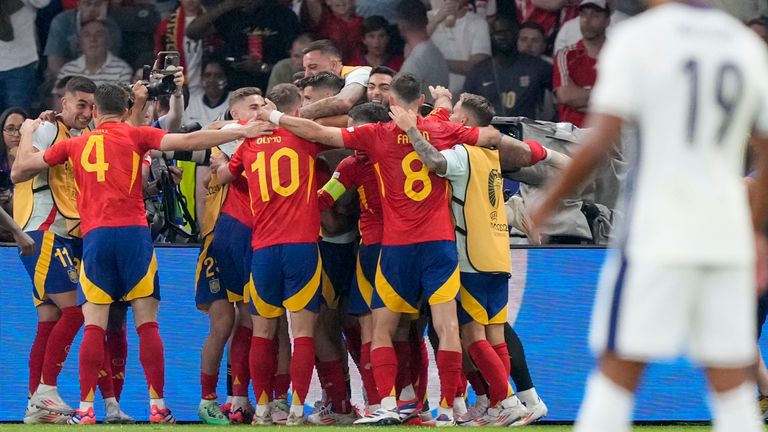 Spain's Mikel Oyarzabal celebrates with teammates after scoring his side's second goal during the final match against England at the Euro 2024 soccer tournament in Berlin, Germany, Sunday, July 14, 2024. (AP Photo/Martin Meissner)