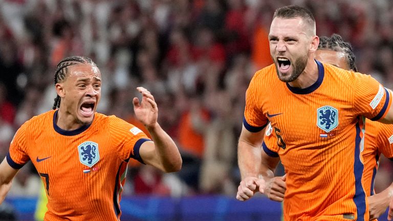 Stefan de Vrij of the Netherlands, right, celebrates with Xavi Simons of the Netherlands after scoring his sides first goal during a quarterfinal match between the Netherlands and Turkey at the Euro 2024 soccer tournament in Berlin, Germany, Saturday, July 6, 2024. (AP Photo/Antonio Calanni)