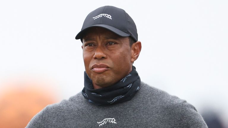 Tiger Woods of the United States takes a club out on the second hole during his opening round of the British Open Golf Championships at Royal Troon golf club in Troon, Scotland, Thursday, July 18, 2024. (AP Photo/Peter Morrison)