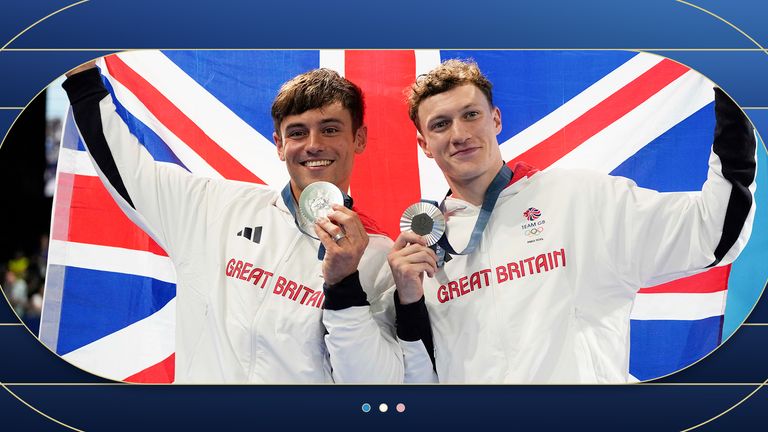 Britain's Tom Daley and Noah Williams celebrate on the podium after winning the silver in the men's synchronised 10m platform diving final