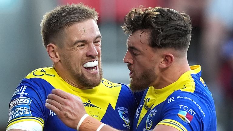 Warrington Wolves' Matthew Dufty (left) celebrates scoring their side's second try of the game with team-mate Matty Ashton during the Betfred Super League match at the Totally Wicked Stadium